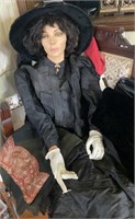 Half a mannequin in Victorian clothes - one arm