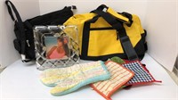 (2) bags (1) glass picture frame (1) bag of mitts