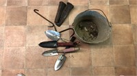 Metal bucket with various tools including: hooks,