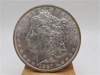 1887 MORGAN SILVER DOLLAR AU 62+
