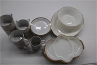 White dishes with gold trim