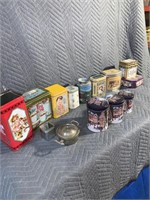 Quantity of collector tins including one musical