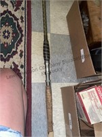 Fishing  pole no brand listed. Approx 10’.