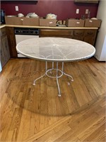 White wrought iron table. Heavy and sturdy.