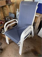 2 nice denim blue outdoor chairs.