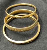 Three Gold-Filled Bangle Bracelets.