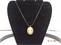 Gold Chain with Woman Siloutte Pendant