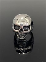 Silver toned smiling skull ring