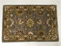Small accent floral rug