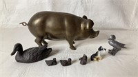 Brass piggy bank with decorative pieces