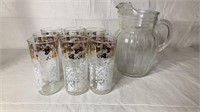 9 water glasses with glass pitcher