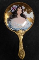 Porcelain and metal hand mirror