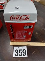 Coca-Cola collectibles in Coke machine cookie jar