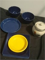 Group of small blue plates and bowls and small