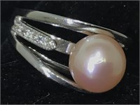 Sterling silver ring with pearl and clear