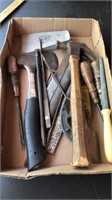 Lot of misc tools.  Hammers, axe, files,