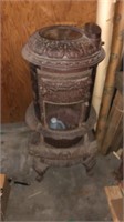 Large antique cast iron round oak stove, with box