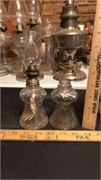 Pair of glass oil lamps.  One is missing the