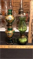 Pair of green glass oil lamps