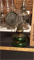 Green glass oil lamp with wall mount