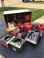 About 23 boxes of Coca-Cola Christmas ornaments
