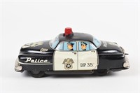 POLICE D.P. 35 TIN LITHO BAT. OP. FRICTION CAR TOY