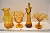 Four pieces of decorative amber glassware