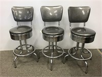 Three heavy Retro style chrome swivel stools