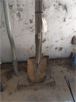 Yard rake and two shovels
other in background