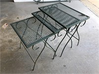 Three metal patio tables;