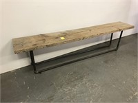 Primitive style bench with pipe base