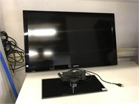 Samsung flat screen TV with stand