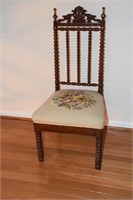 Mahogany chair with needlepoint seat cushion.
