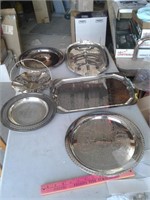 SIX SILVER COLORED TRAYS