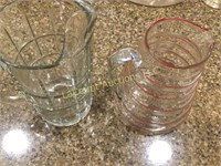 2 pitchers striped glass good condition