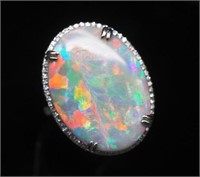 Solid black opal and diamond set white gold ring