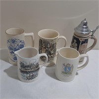 Four Vintage Steins and One Pitcher