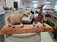 Locally carved pack horse and cowboy