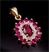 Created ruby, diamond and 9ct yellow gold pendant
