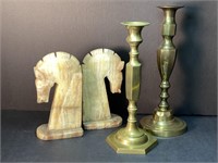Stone horse head bookends & two brass candlesticks
