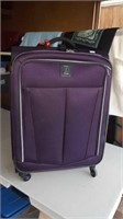 Purple Travelpro suitcase 12 inches by 18.5 in by
