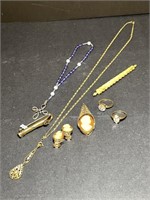 Posey holder pin, pocket rosary & more