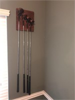 4 Power Bilt Golf Clubs with hanging rack