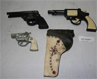 3 TOY PISTOLS & 1 LEATHER HOLSTER