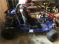 Blue 2 seater go car. With helmet broke frame and