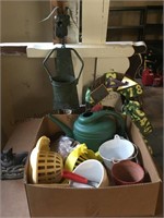 Watering can, shells, flower pots and