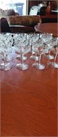 Group of 12 etched glass champagne glasses