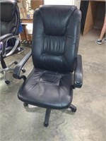 Black padded office chair with arm rests