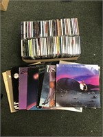 Box of records and CDs with R&B artists such as