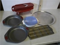 lot of baking pans, tupperware and kitchen